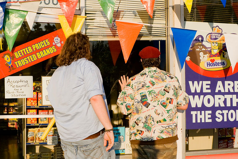 Ryan and Patrick looking in the window of a Hostess outlet store